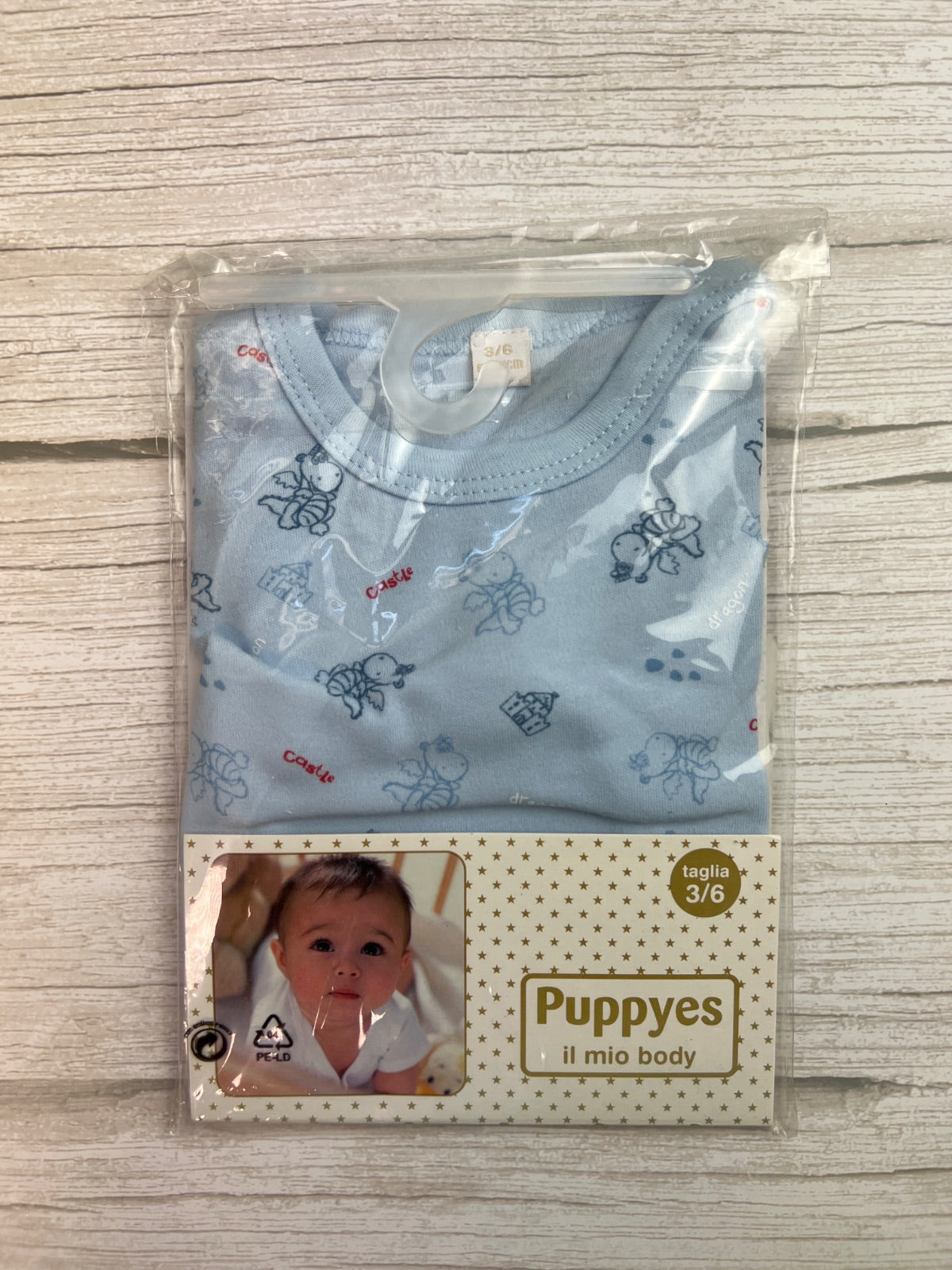 Body neonato Puppyes azzurro con stampa draghi