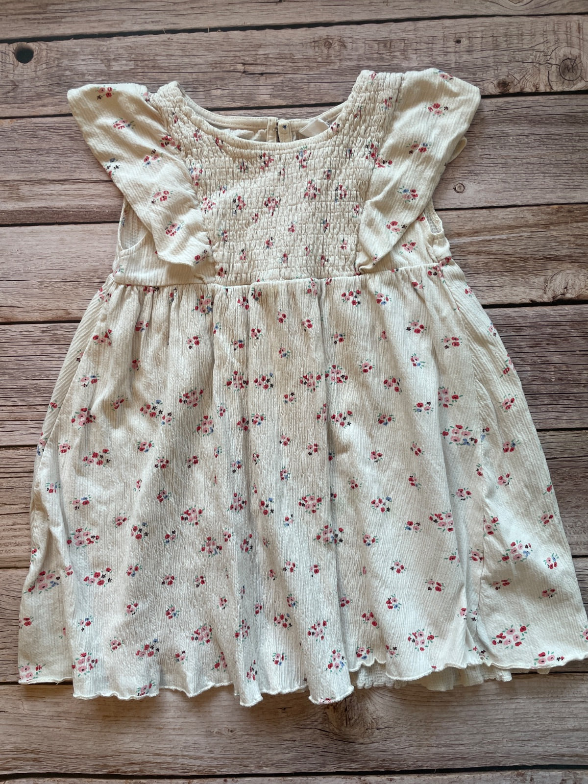 Vestito bambina floreale con corpetto smock