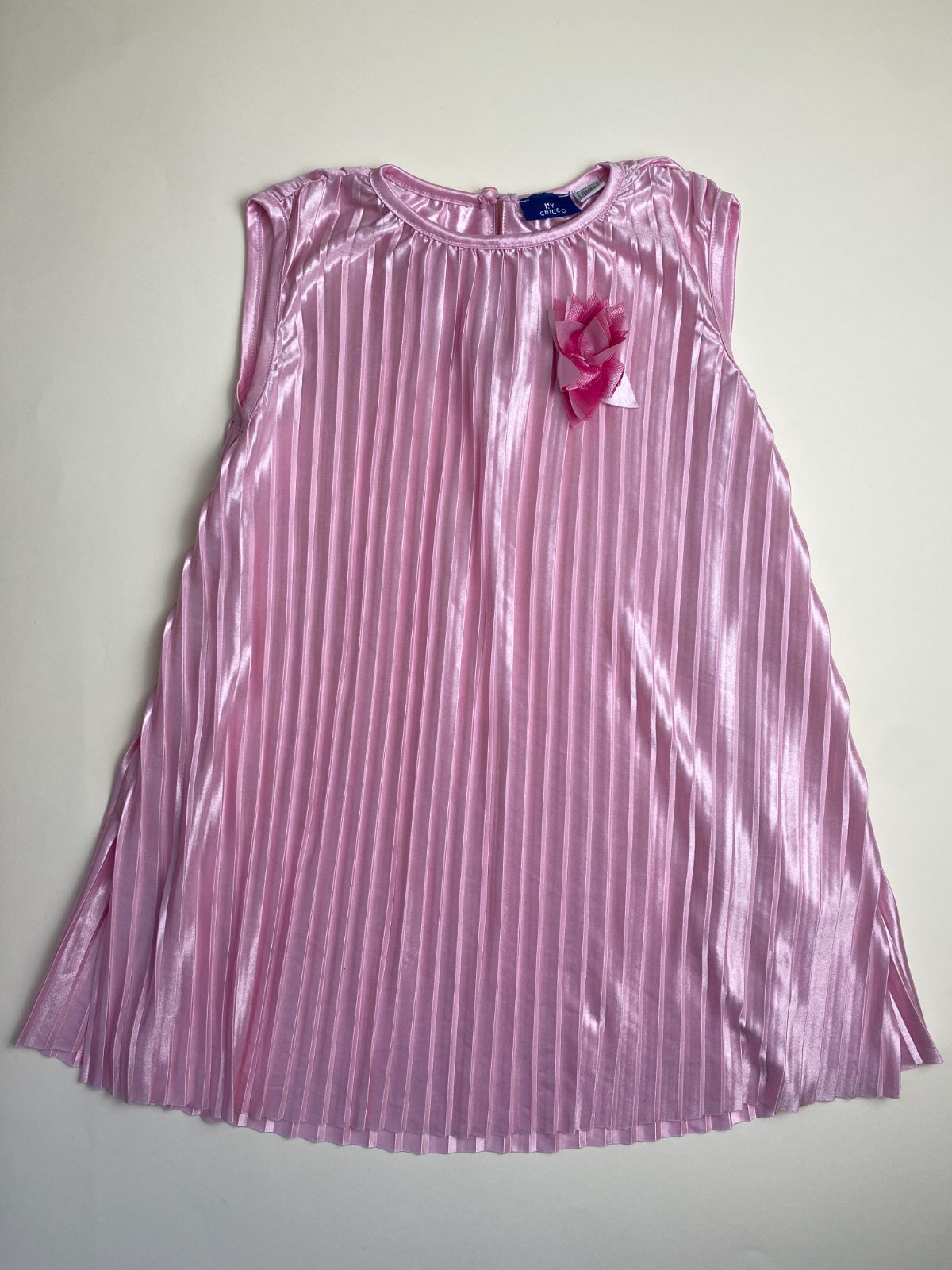Vestito rosa plissettato per bambina