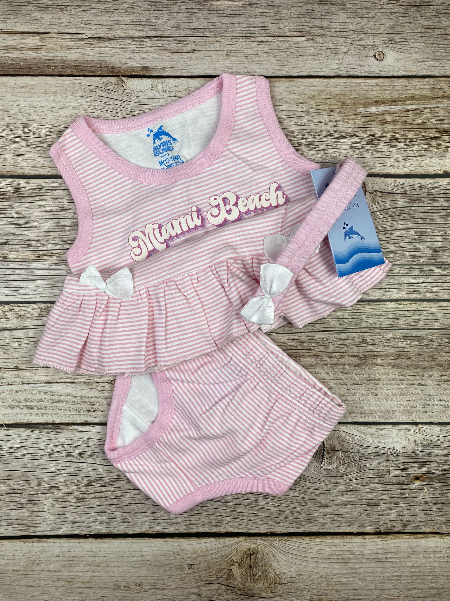 Set T-shirt senza manica, slip e fascia per capelli
