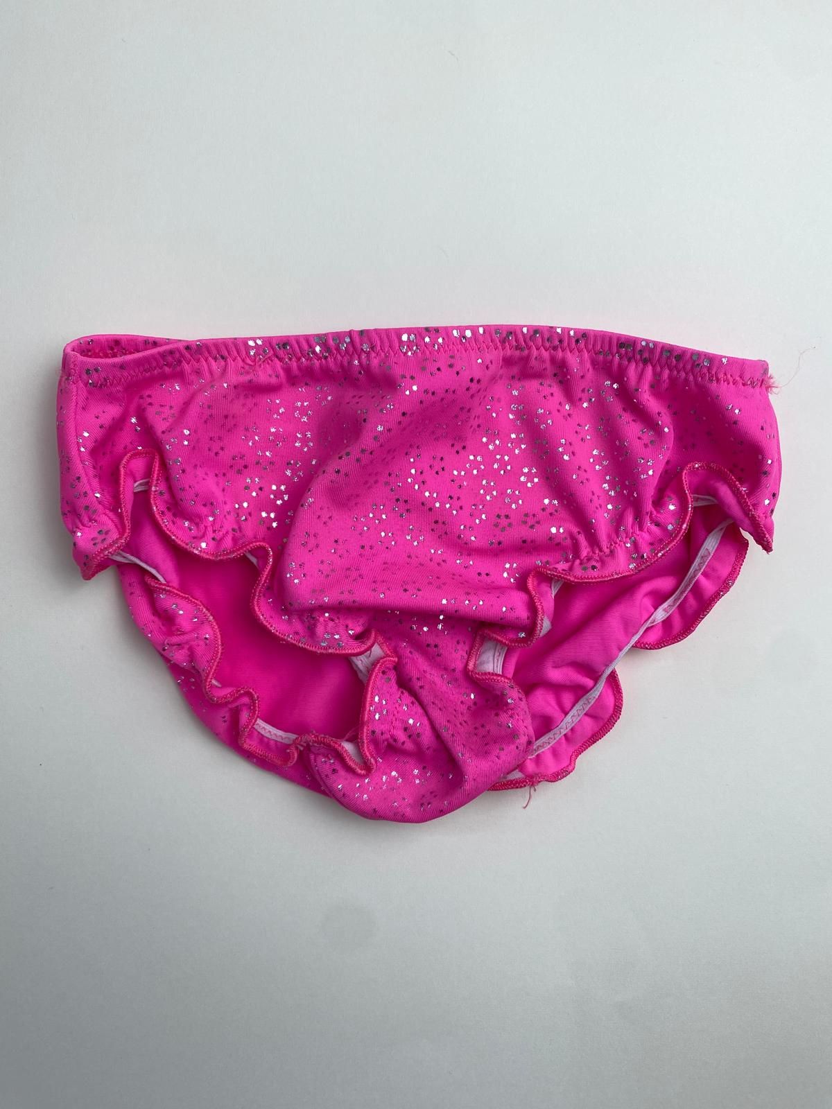Slip da bagno bambina fucsia con glitter e volant