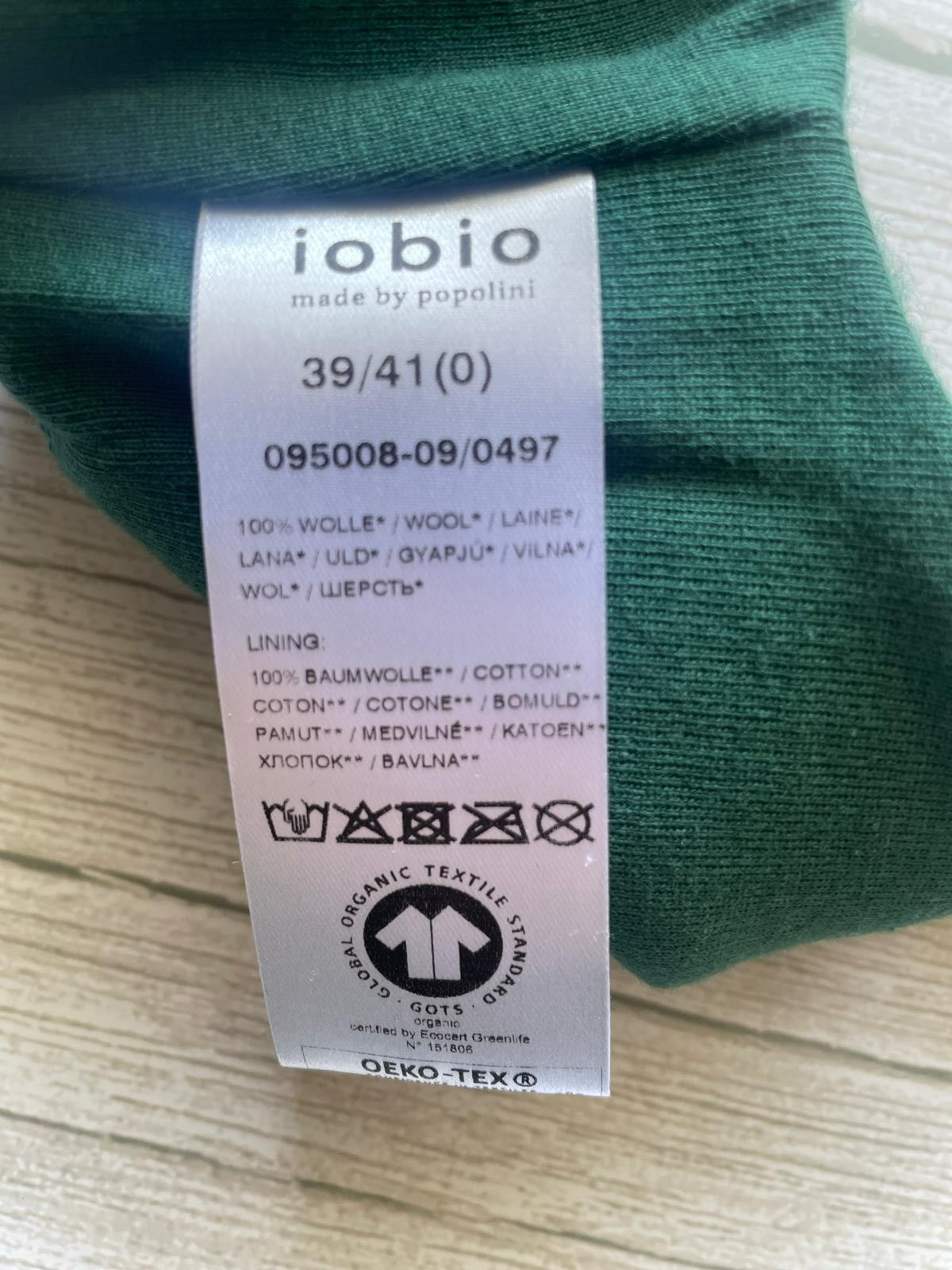 Cappello neonato in lana con laccetti