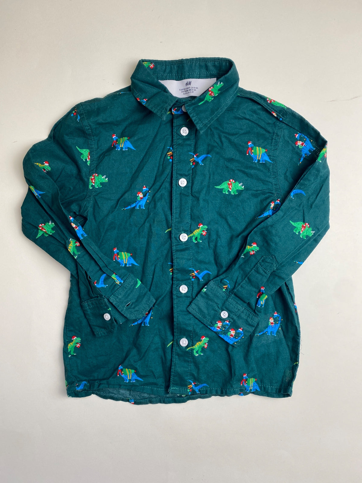 Camicia bambino H&M con dinosauri natalizi