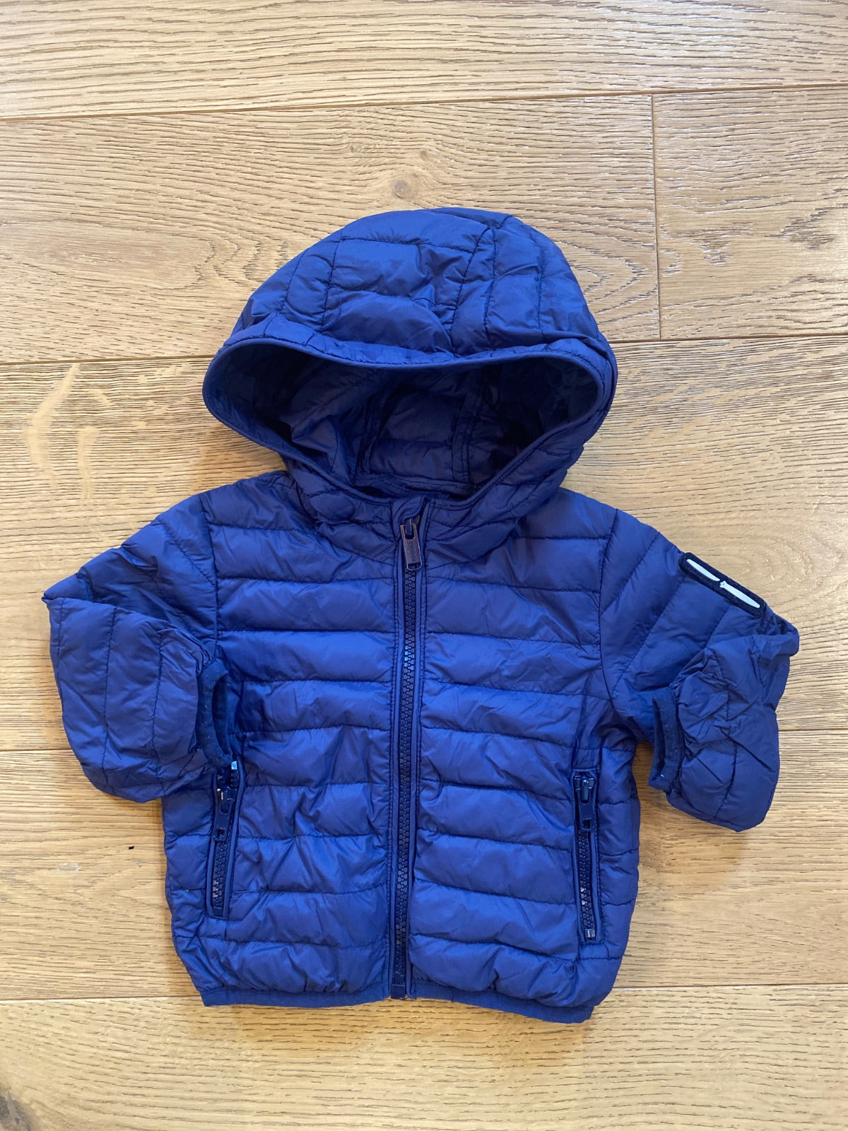 Piumino leggero blu con cappuccio per neonato/bambino