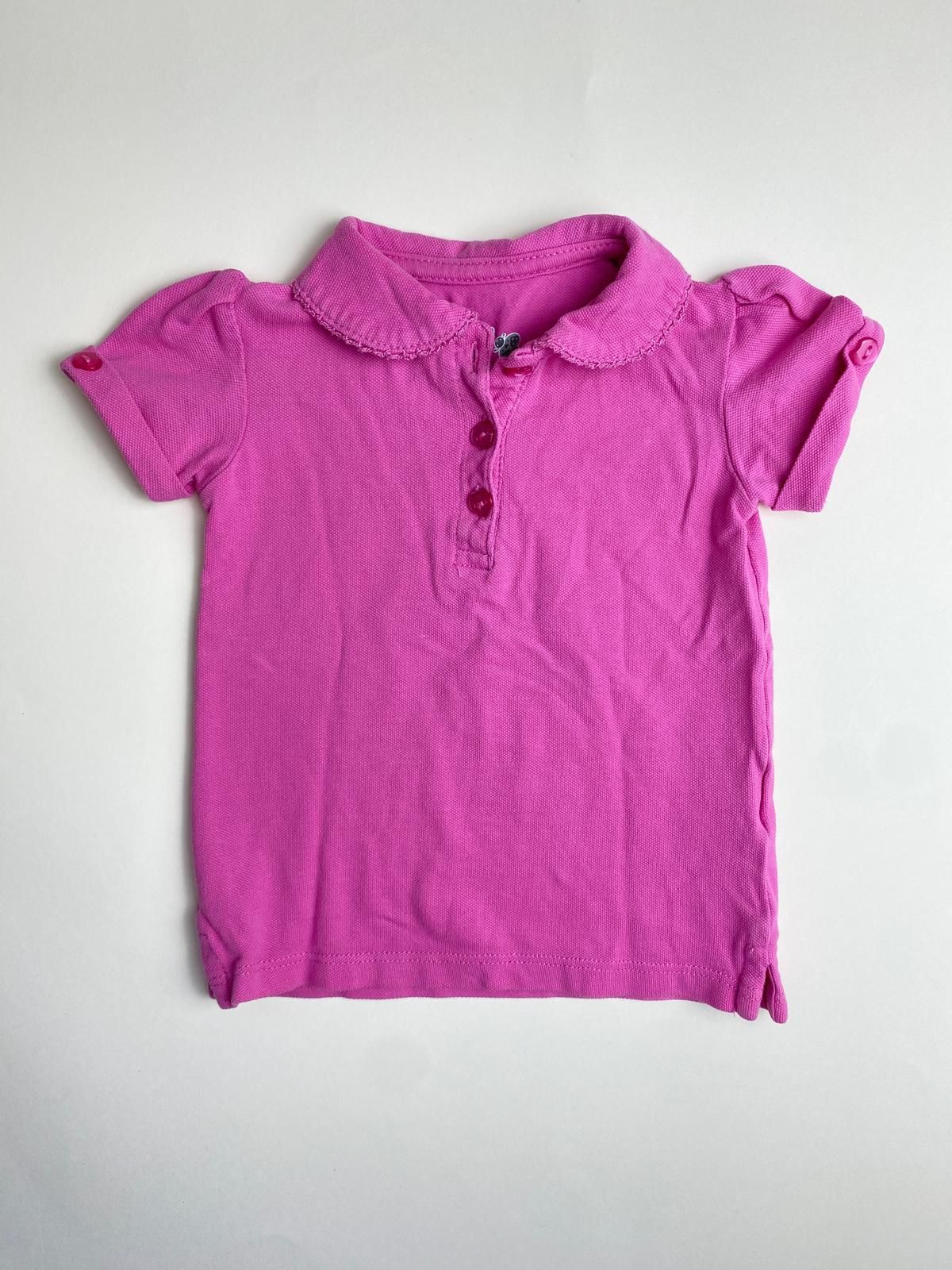 Polo fucsia con colletto smerlato per bambina