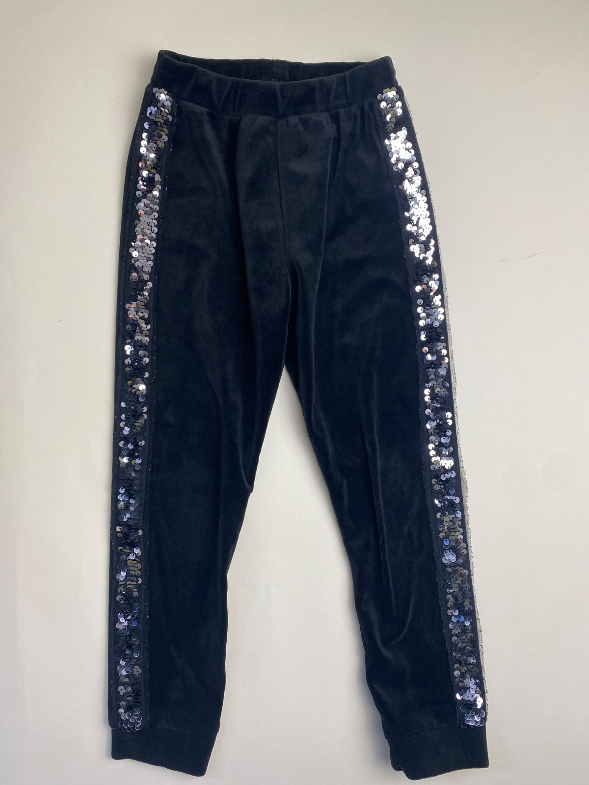 Pantaloni neri in velluto con bande laterali di paillettes