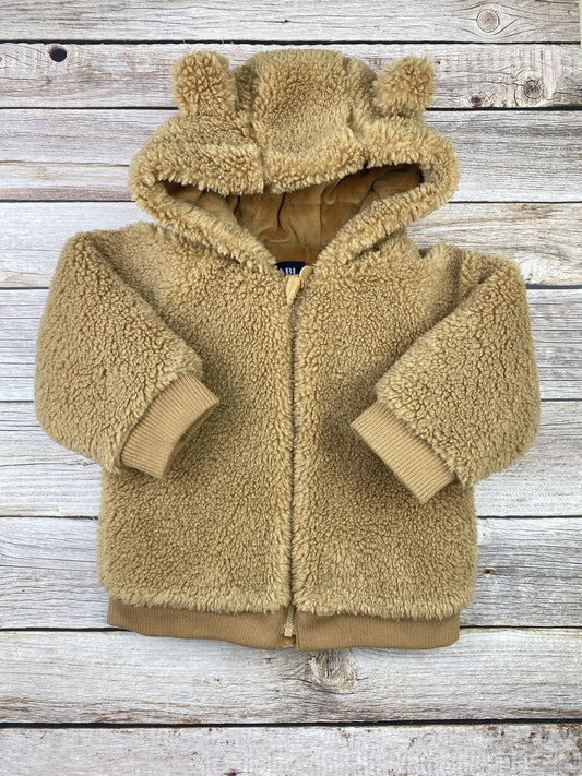 Giacca in pellicciotto con cappuccio