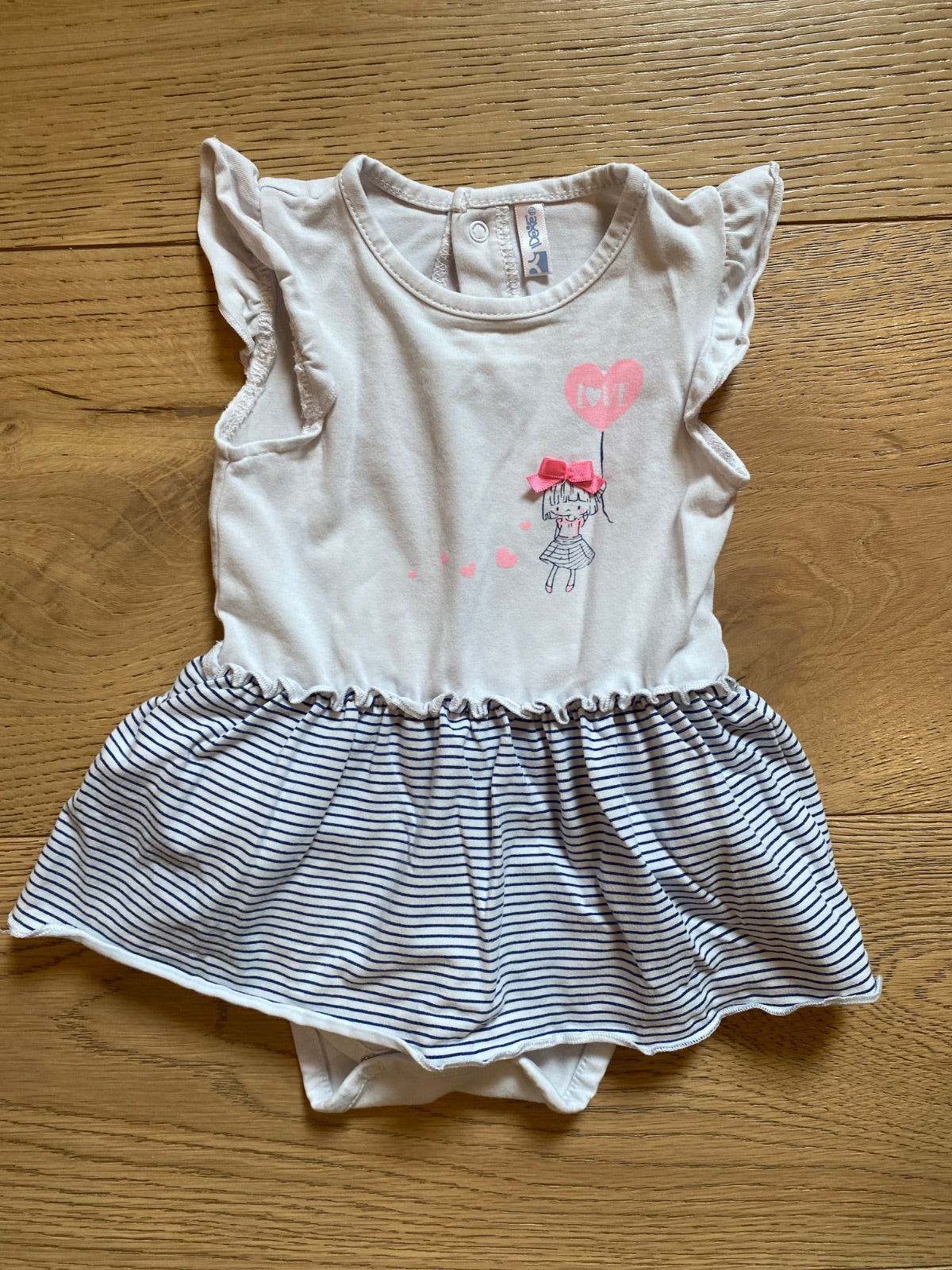 Pagliaccetto vestito neonata con stampa e righe
