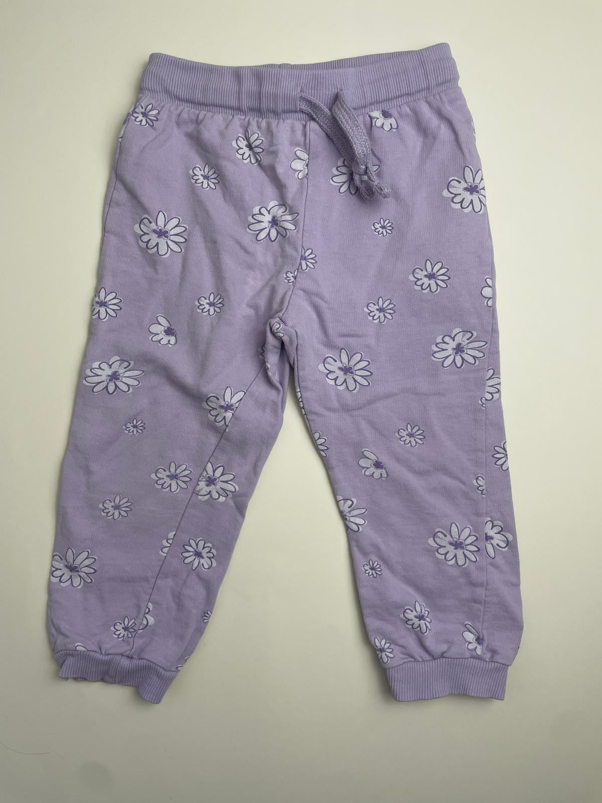 Pantaloni tuta bambina lilla con stampa floreale