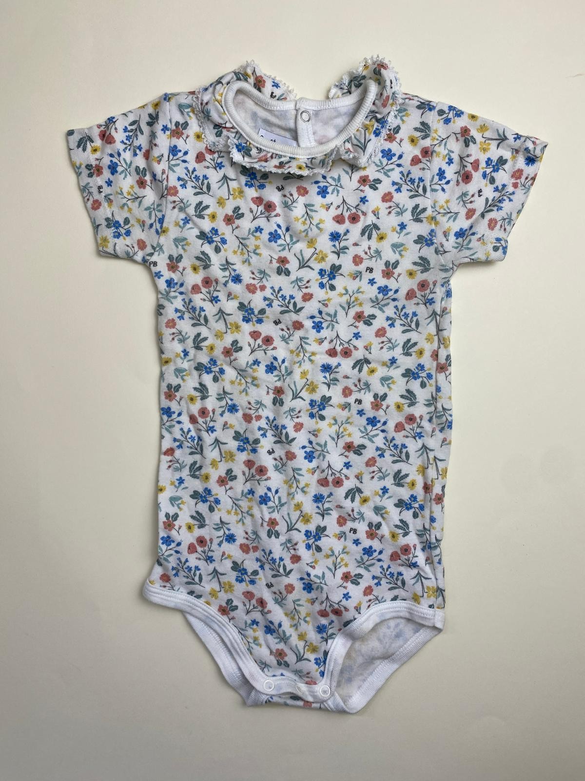 Body neonata a maniche corte con colletto a ruches e stampa floreale