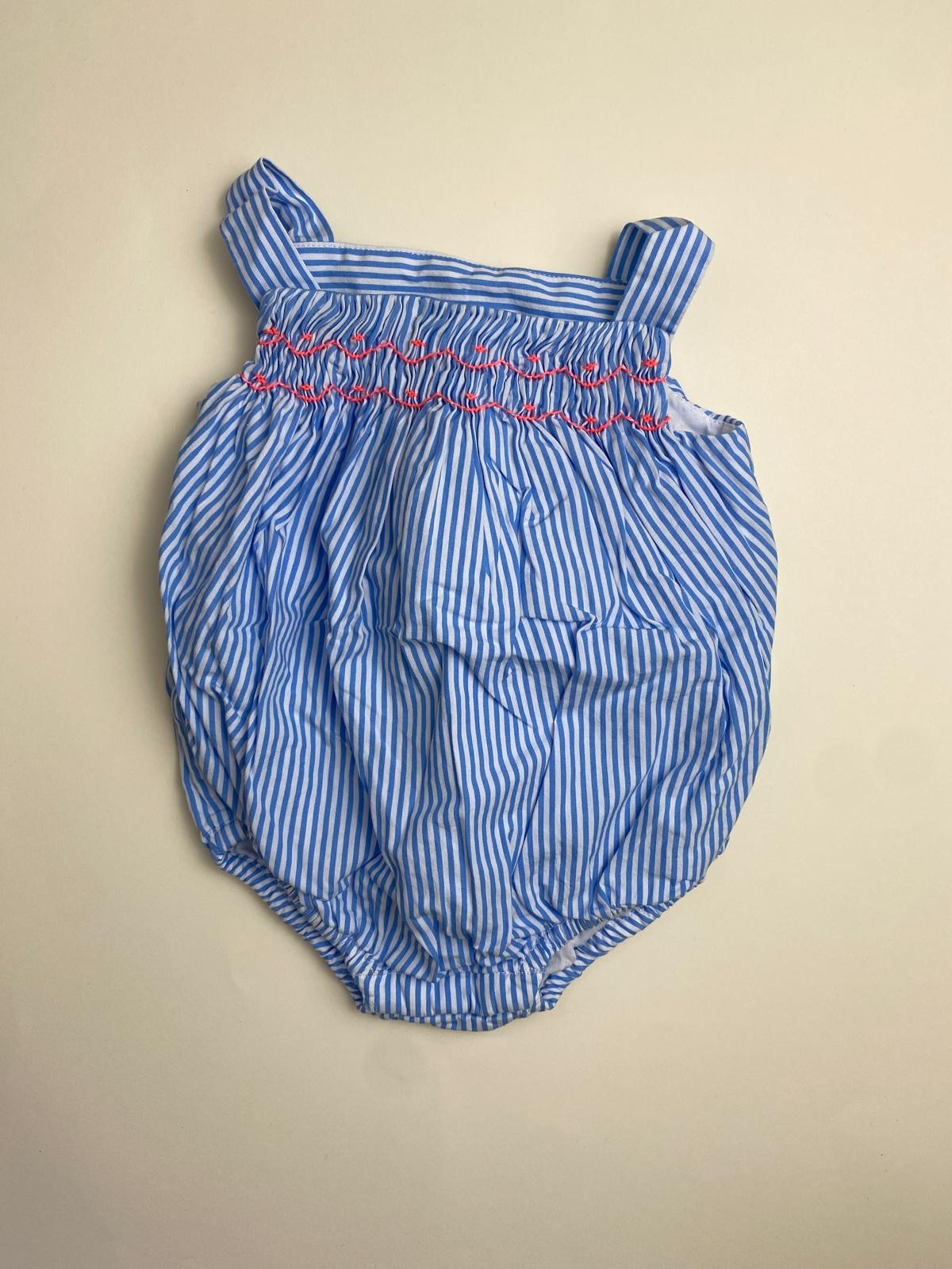 Pagliaccetto Neonata a Righe Blu e Bianche con Smock Rosa