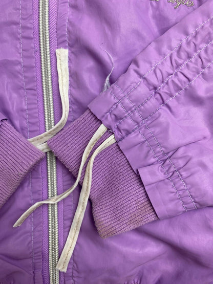 Giacca a vento viola con cappuccio e paillettes
