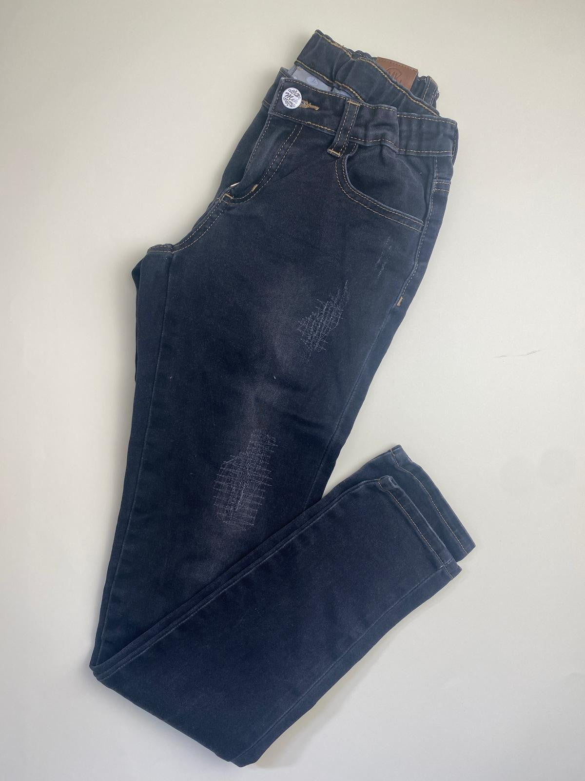 Jeans skinny neri distressed con vita elasticizzata