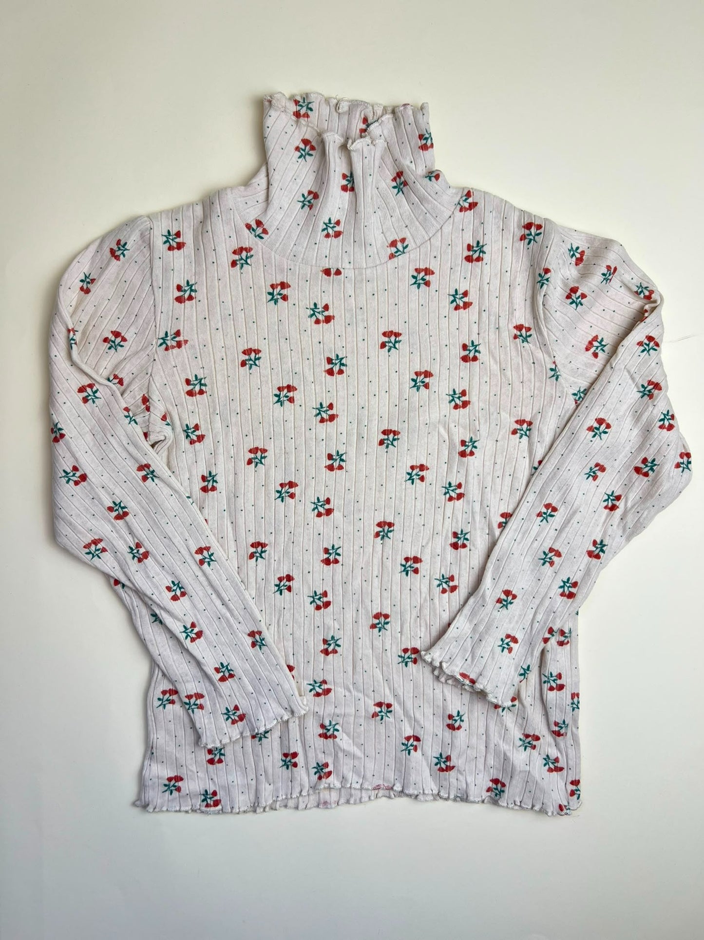 Maglia a collo alto a costine con stampa floreale