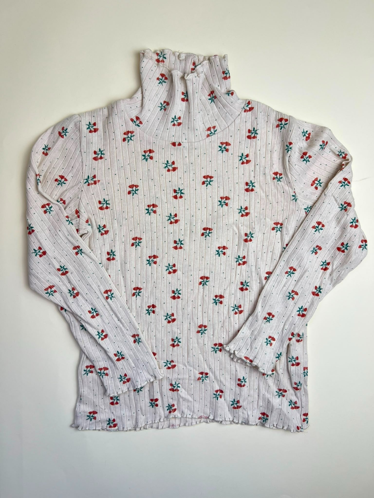 Maglia a collo alto a costine con stampa floreale