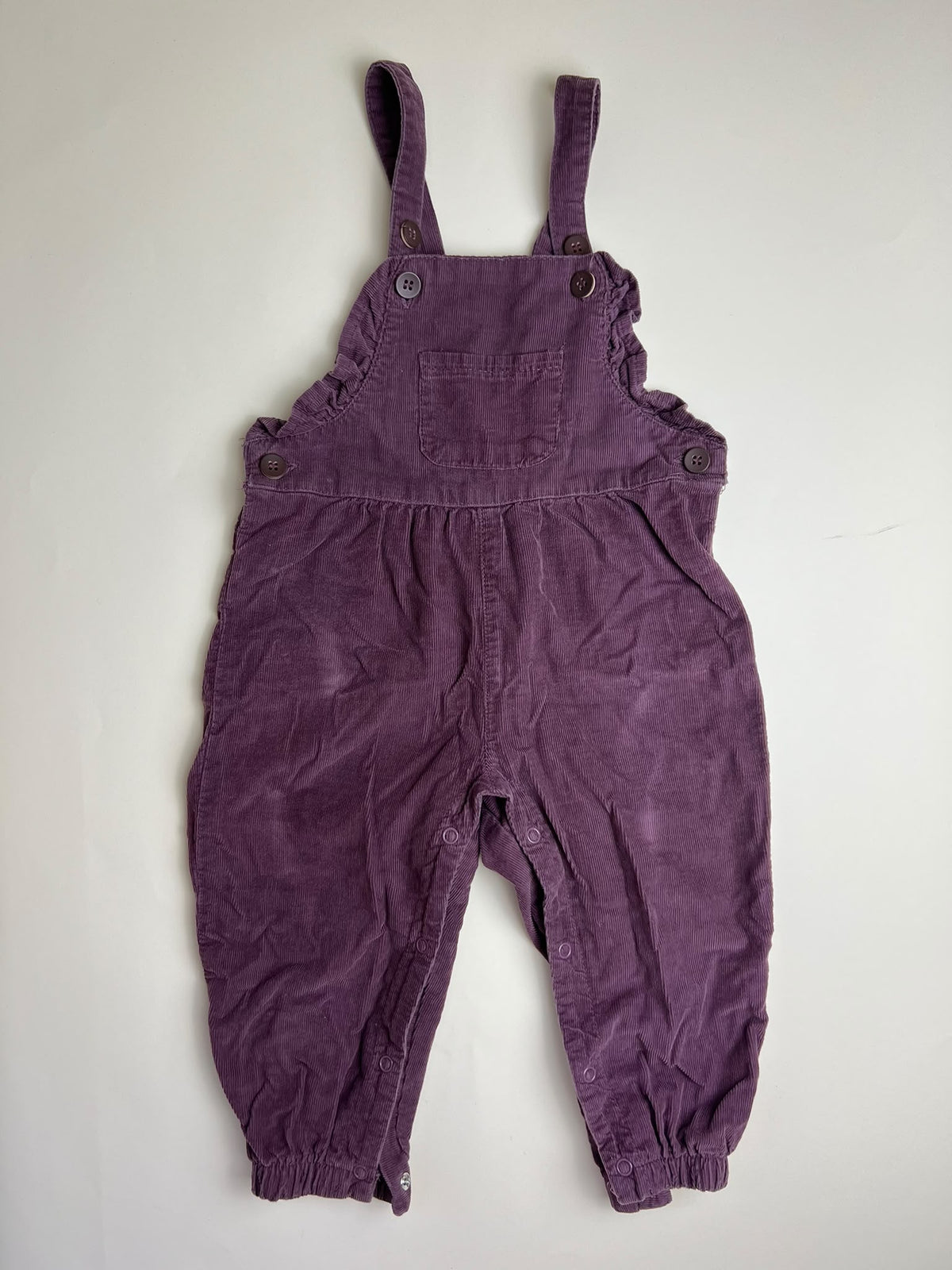 Salopette in velluto a coste viola per bambina