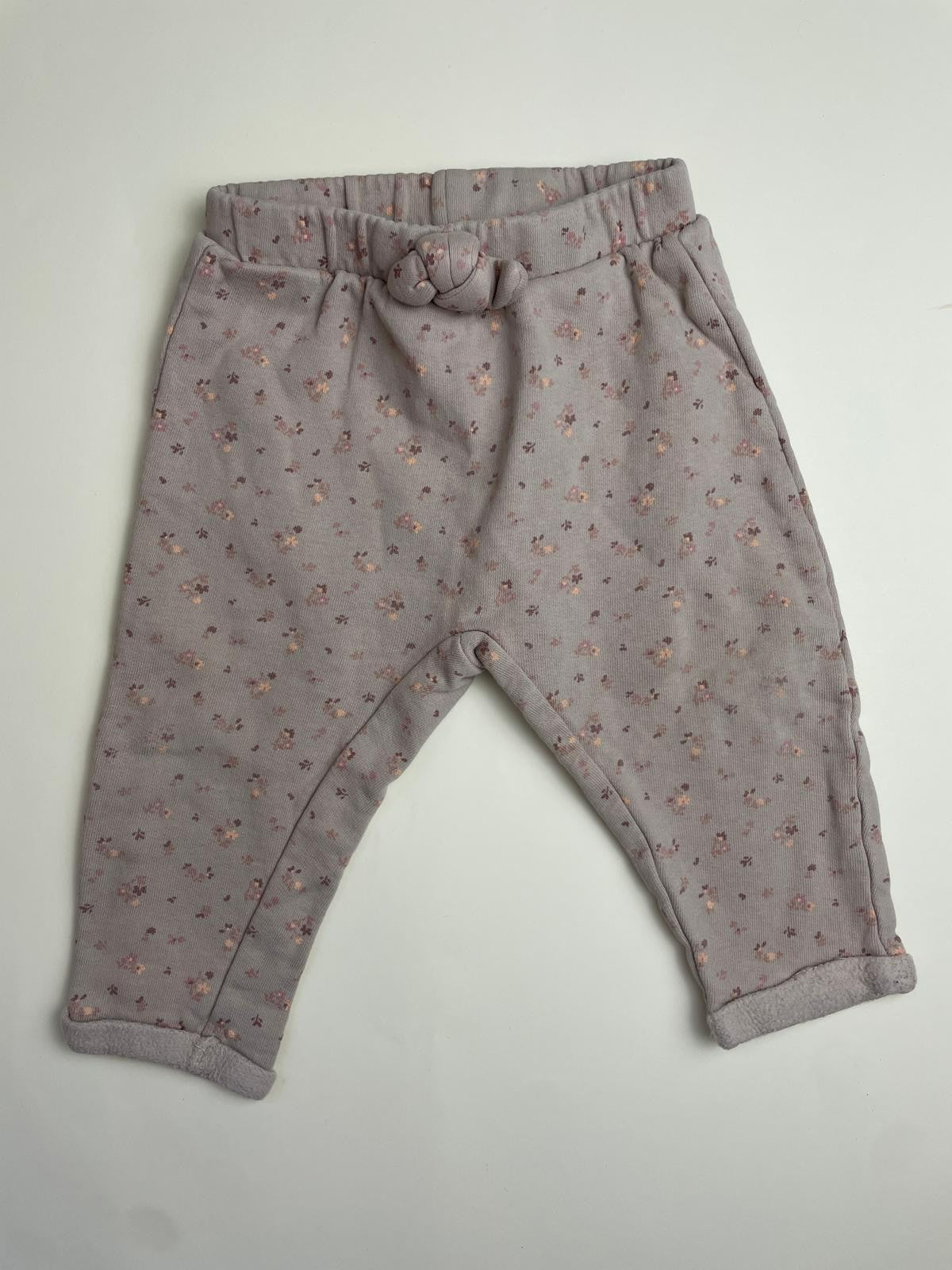 Pantaloni stampa floreale e nodo decorativo