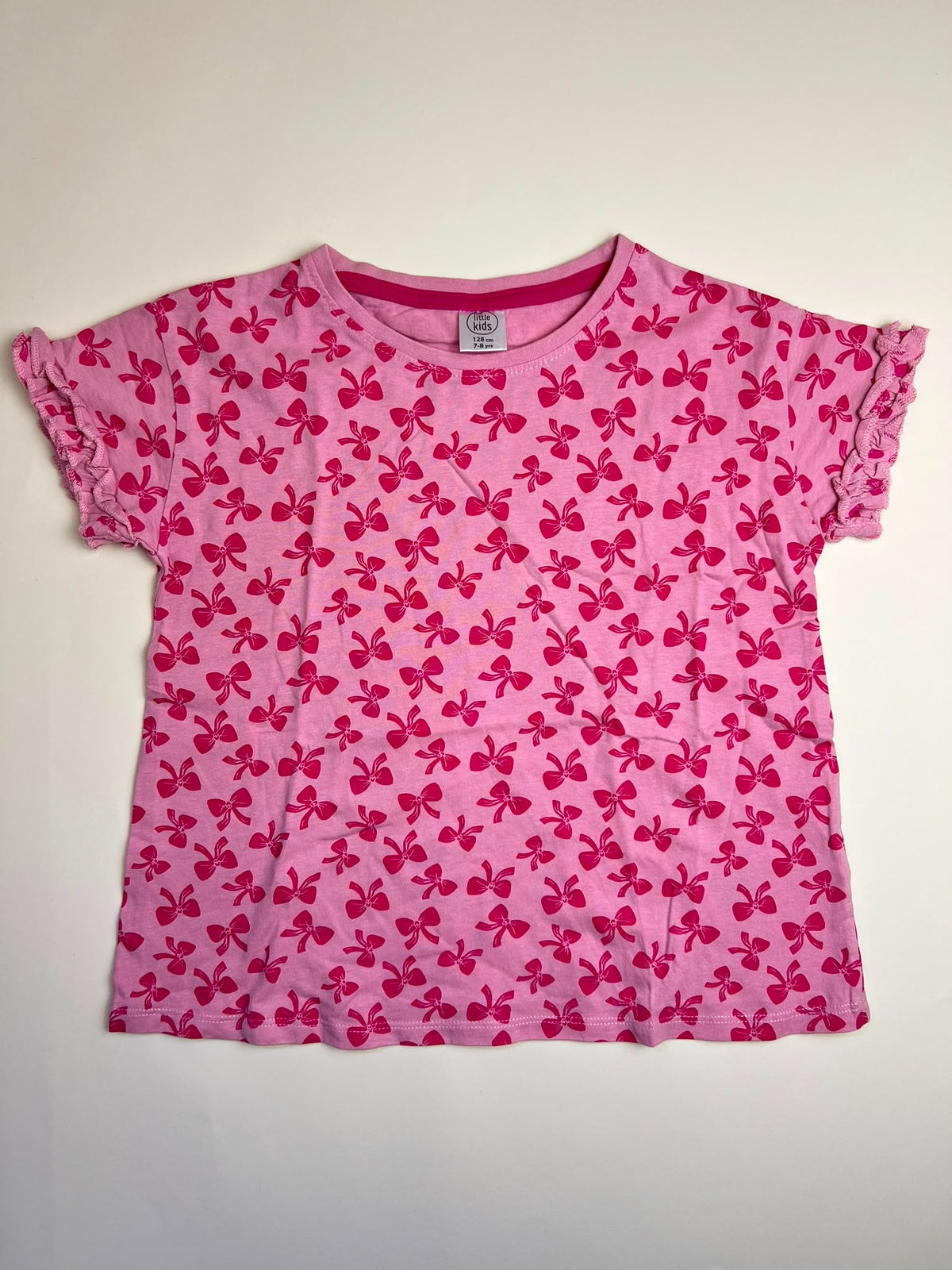 T-shirt Bambina Rosa con Stampa Fiocchi e Maniche a Volant