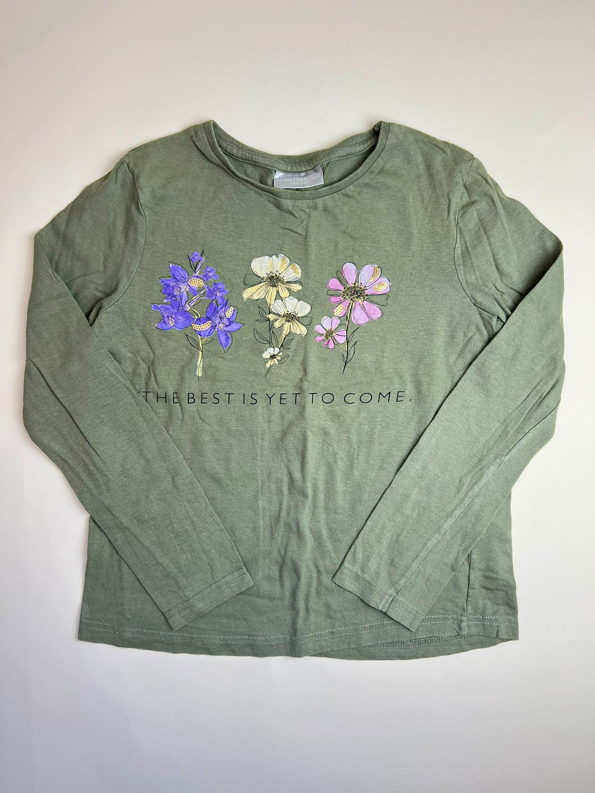 Maglietta a maniche lunghe verde con stampa floreale