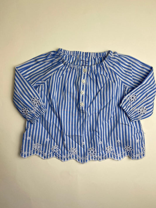 Camicetta a righe blu e bianche con ricami per bambina