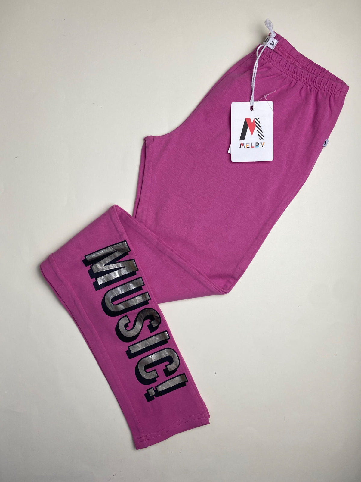 Leggings fucsia con stampa "MUSIC!" - difetto su fondo gamba