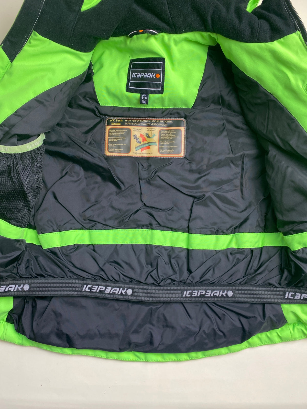 Giacca da sci verde fluorescente con cappuccio - macchie sul davanti