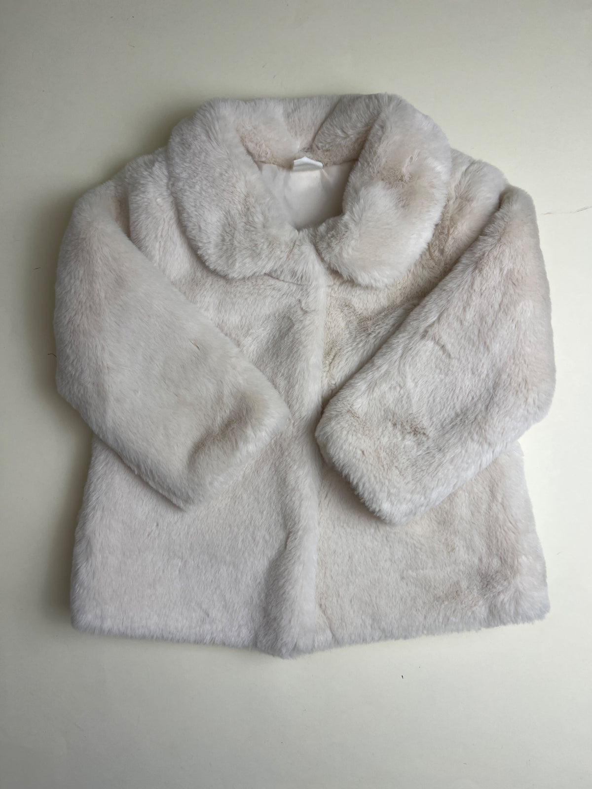 Cappotto in pelliccia sintetica color crema