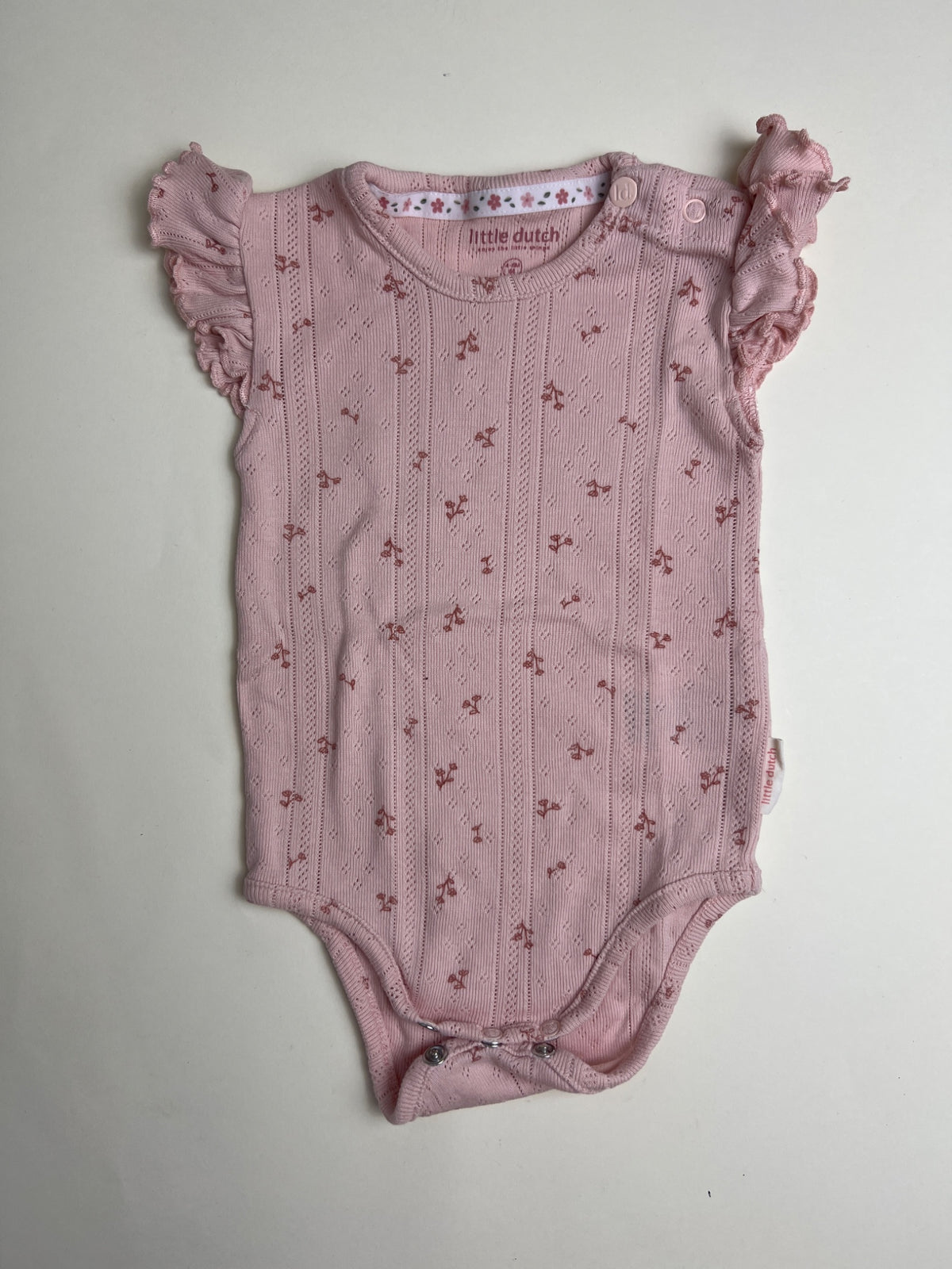 Body neonato Little Dutch rosa con volant e motivo floreale